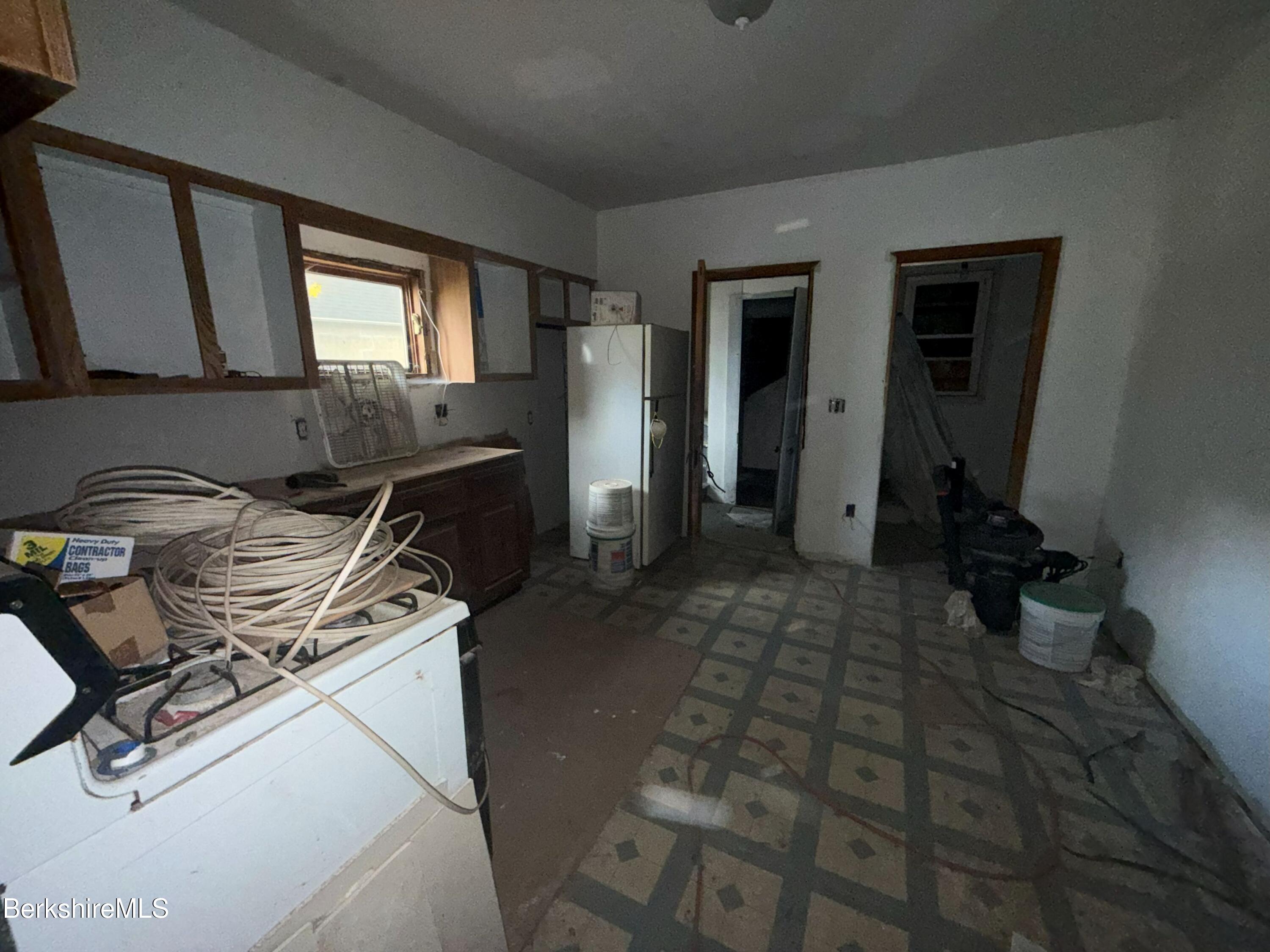 32-38 Spring Street North Adams, MA 01247 - Photo 4 of 32 a kitchen with a stove and a window