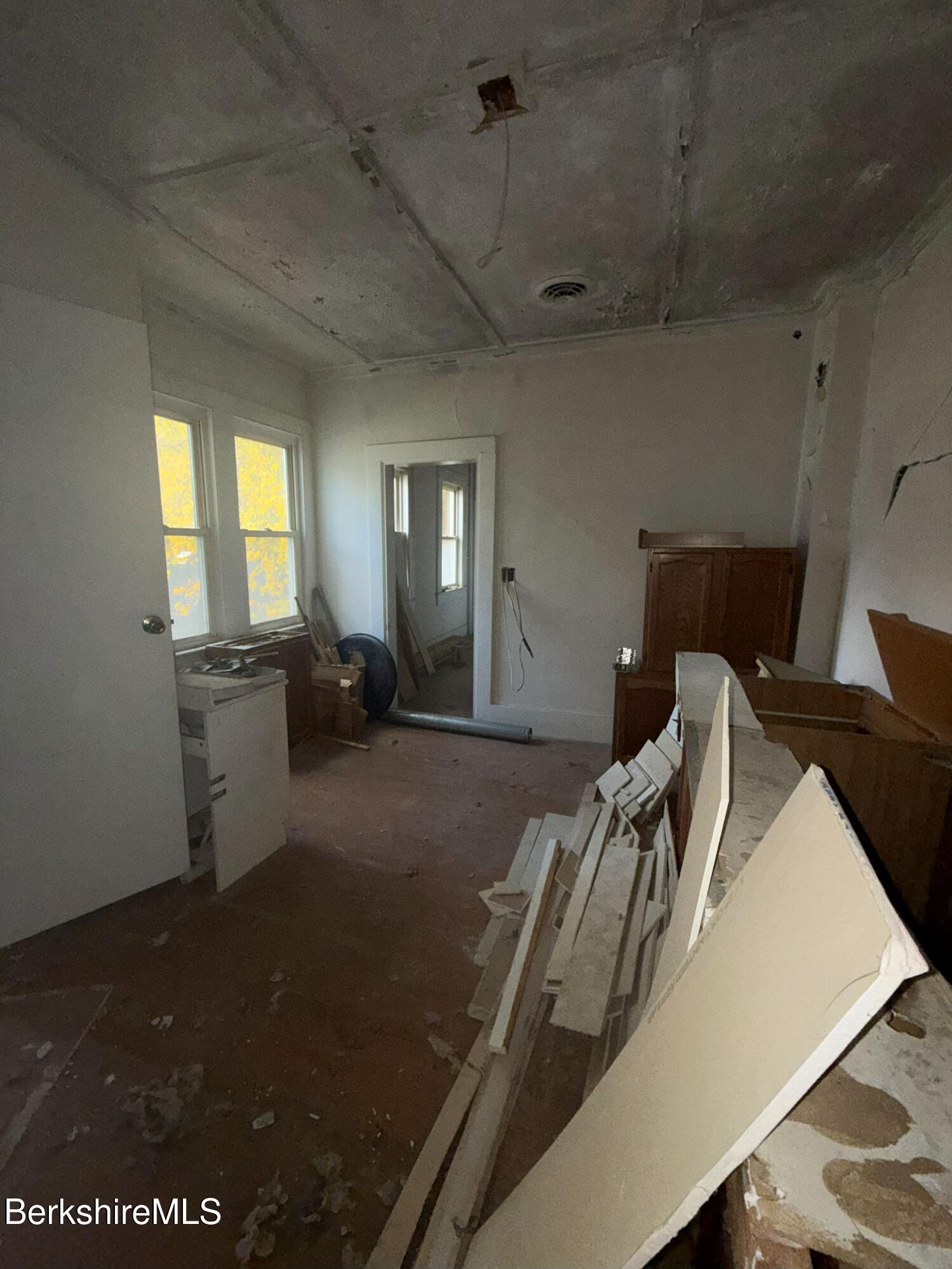 32-38 Spring Street North Adams, MA 01247 - Photo 5 of 32 a view of a kitchen with furniture and windows