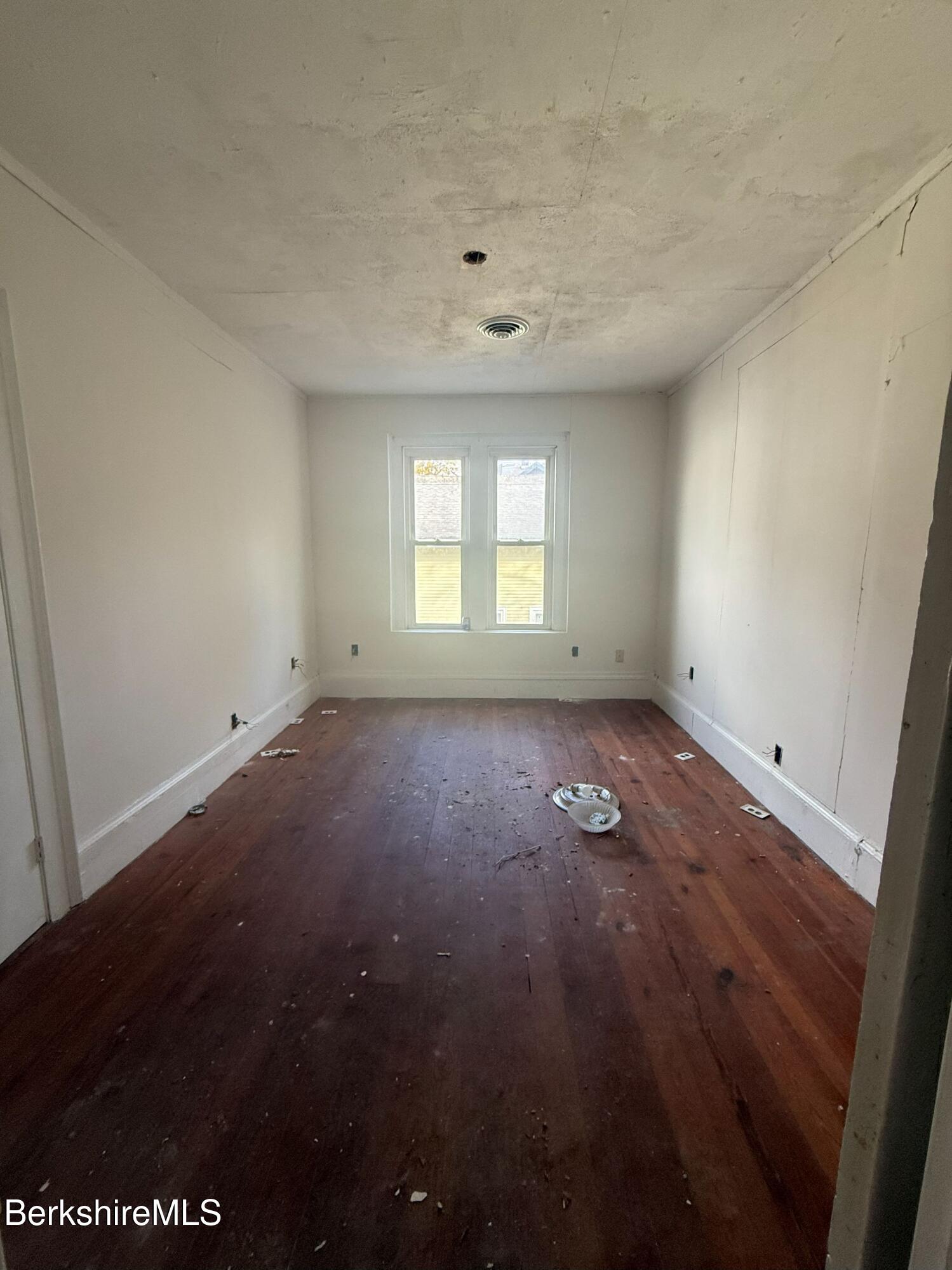 32-38 Spring Street North Adams, MA 01247 - Photo 7 of 32 an empty room with wooden floor and windows