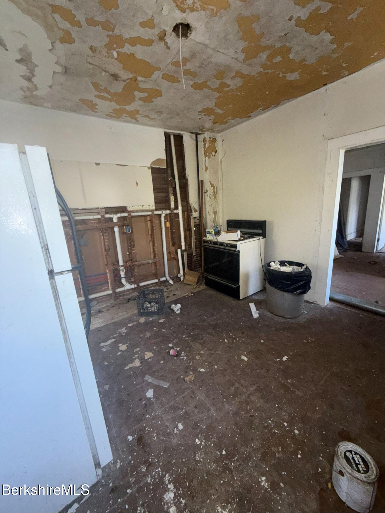 32-38 Spring Street North Adams, MA 01247 - Photo 10 of 32 a view of entryway with kitchen and stairs