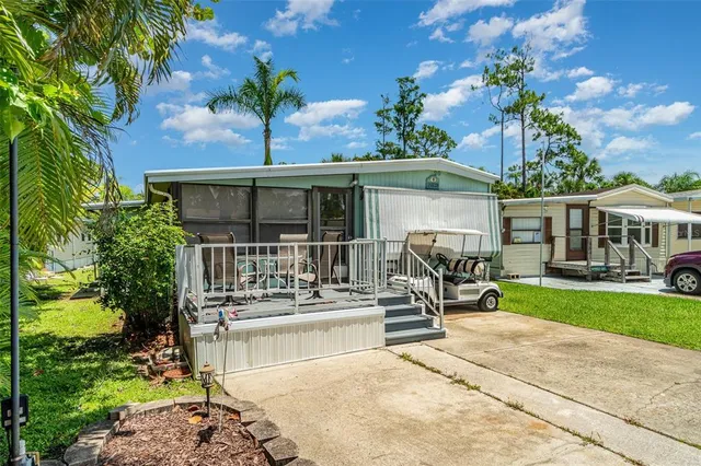 a front view of house with yard patio and green space