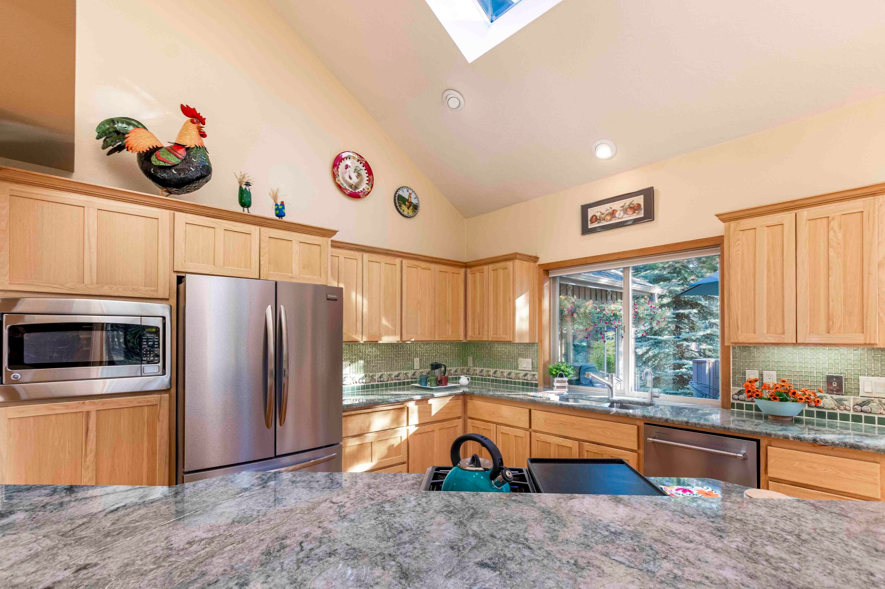 57730 Filbert Lane, Unit 26 Sunriver, OR 97707 - Photo 9 of 36 Custom granite counters and tiled backsplash create a lovely space to prepare meals of any caliber.