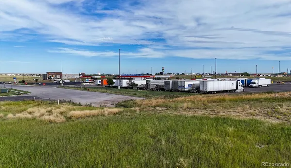 a view of swimming pool with lawn chairs