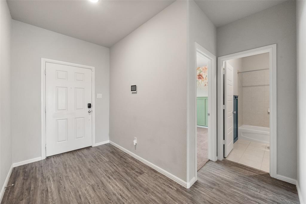 6910 Prairieside Trail Venus, TX 76084 - Photo 24 of 40 Located back near the entry is the 5th bedroom and 2nd full bathroom!