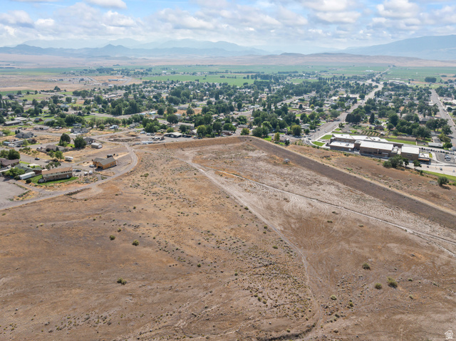 500 East Sand Canyon Road Monroe, UT 84754 - Photo 3 of 12 Aerial view of property's location featuring a mountain backdrop and rural landscape