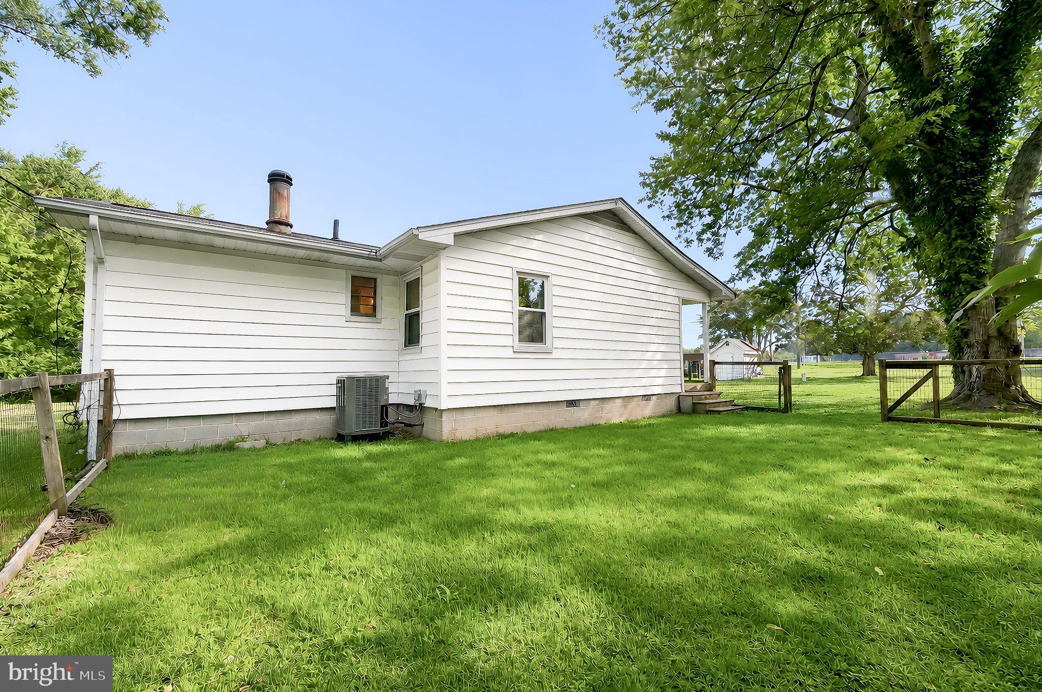 13315 Point Lookout Road Ridge, MD 20680 - Photo 41 of 51 Charming home with lush green yard.