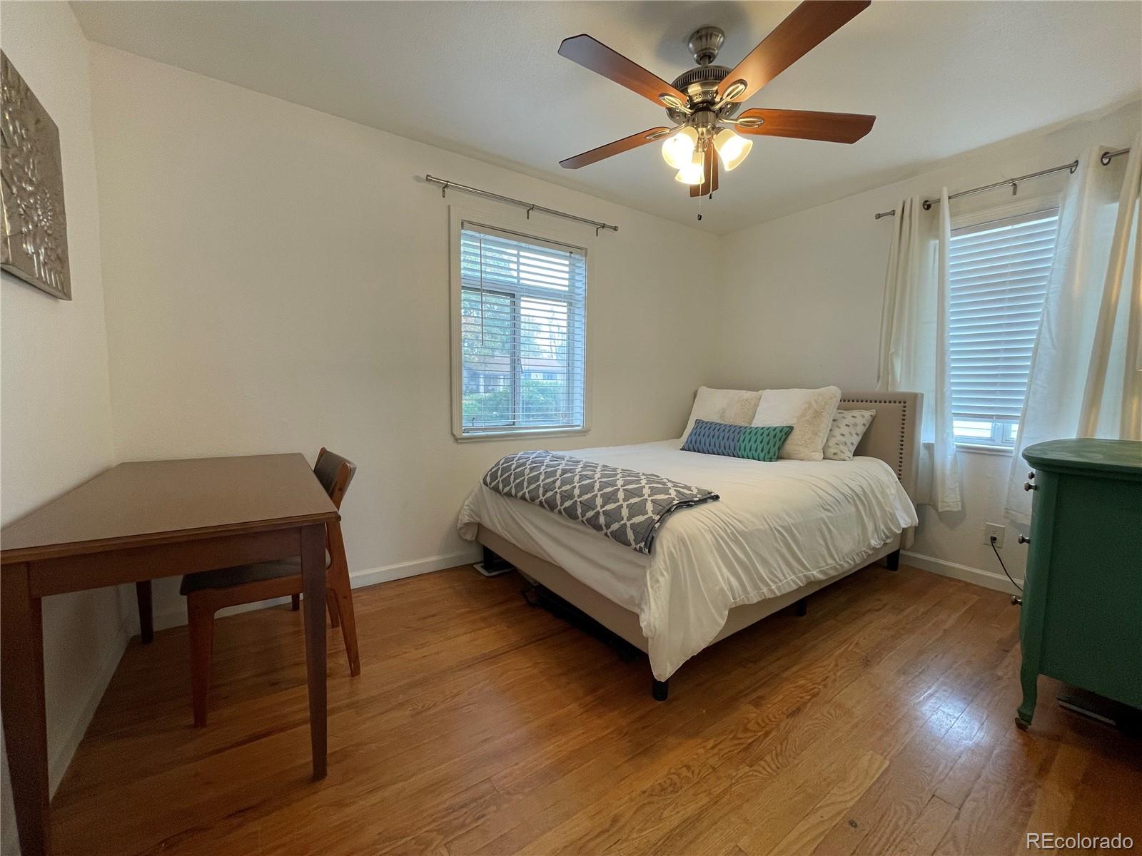 982 South Pecos Way Denver, CO 80223 - Photo 20 of 30 a bedroom with a bed a window and closet