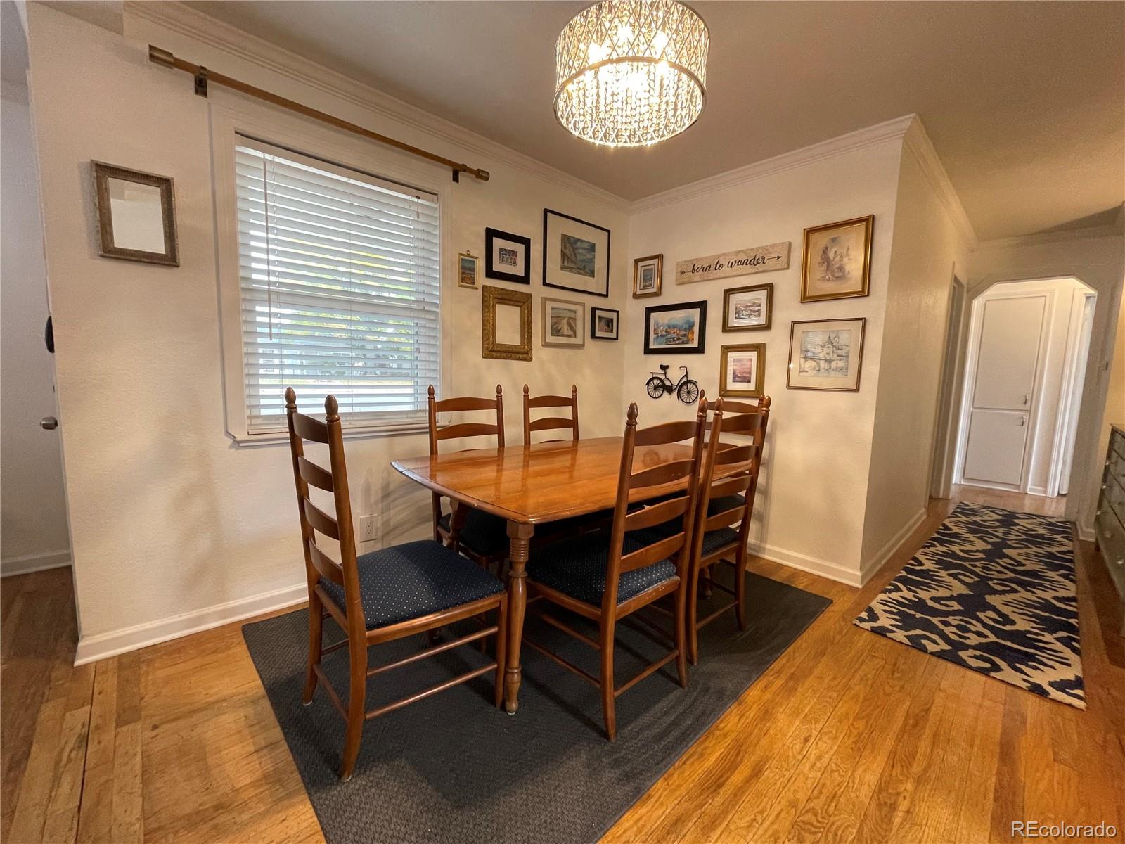 982 South Pecos Way Denver, CO 80223 - Photo 5 of 30 a dining room with furniture and window