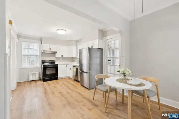 a kitchen with a table and chairs in it