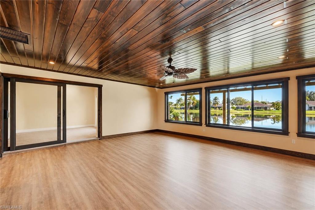 2274 Queens Way Naples, FL 34112 - Photo 4 of 28 a view of room with window and wooden floor