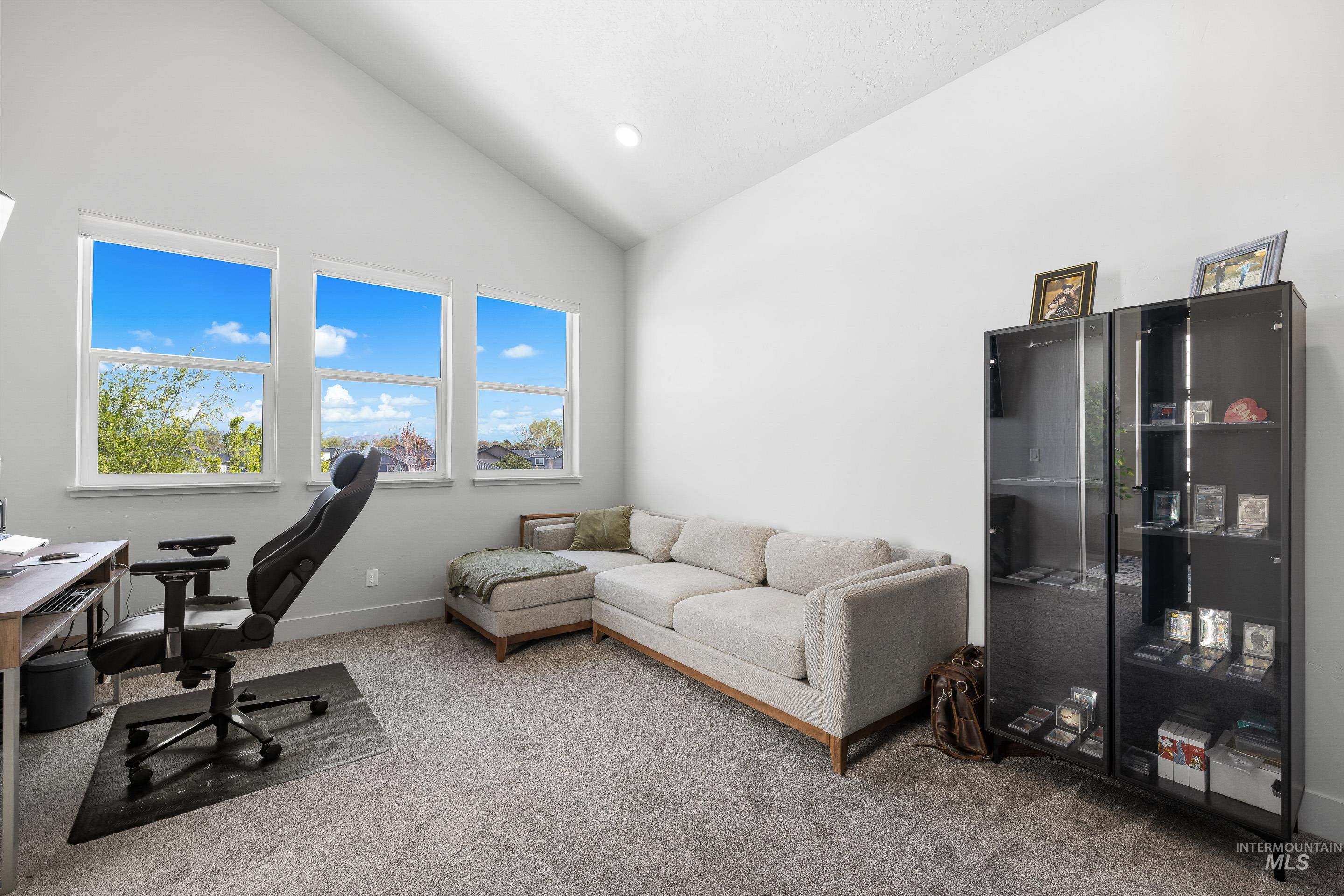 3483 South Grenze Way Meridian, ID 83642 - Photo 12 of 30 Carpeted home office with vaulted ceiling and recessed lighting