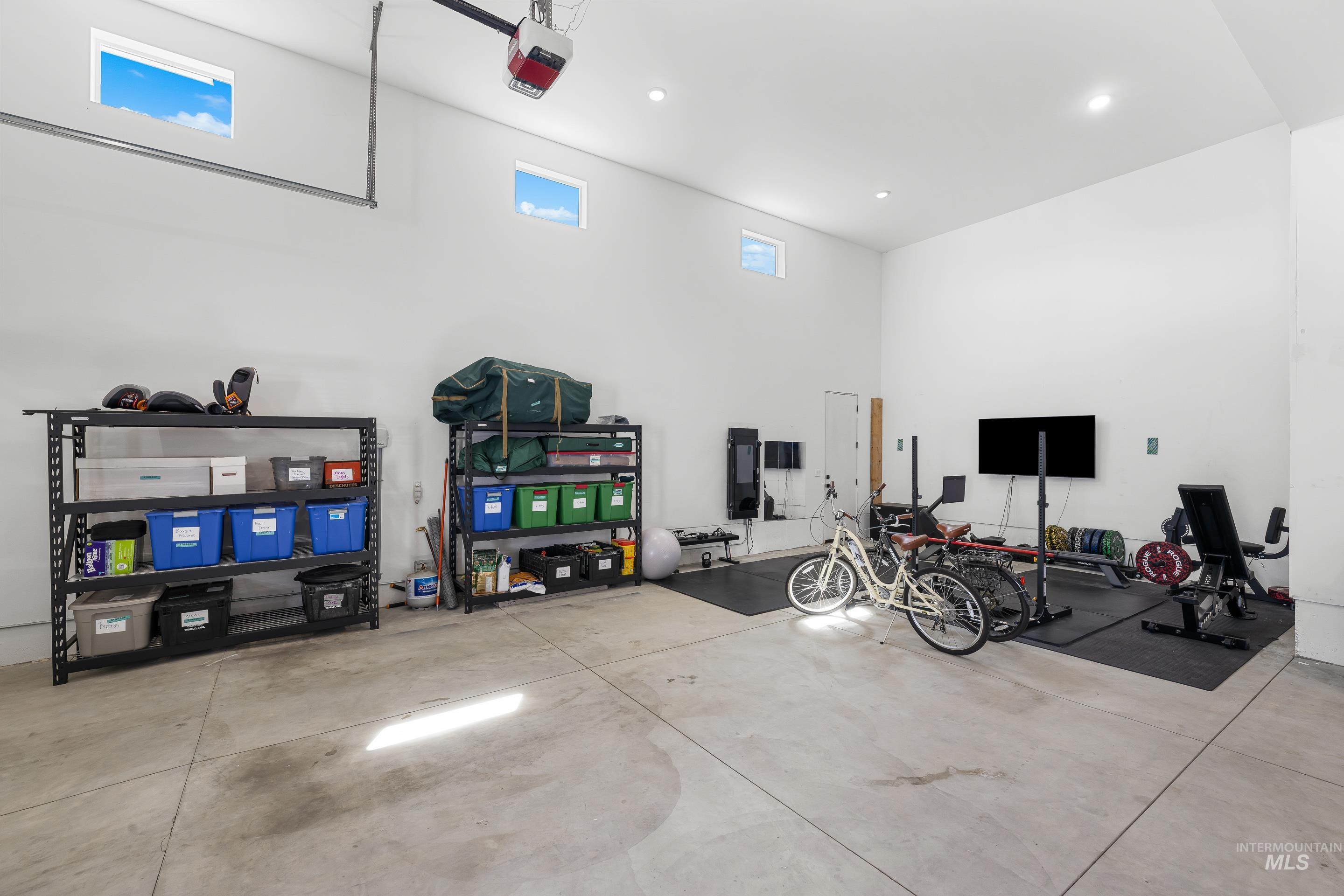 3483 South Grenze Way Meridian, ID 83642 - Photo 24 of 30 Garage featuring a garage door opener and recessed lighting