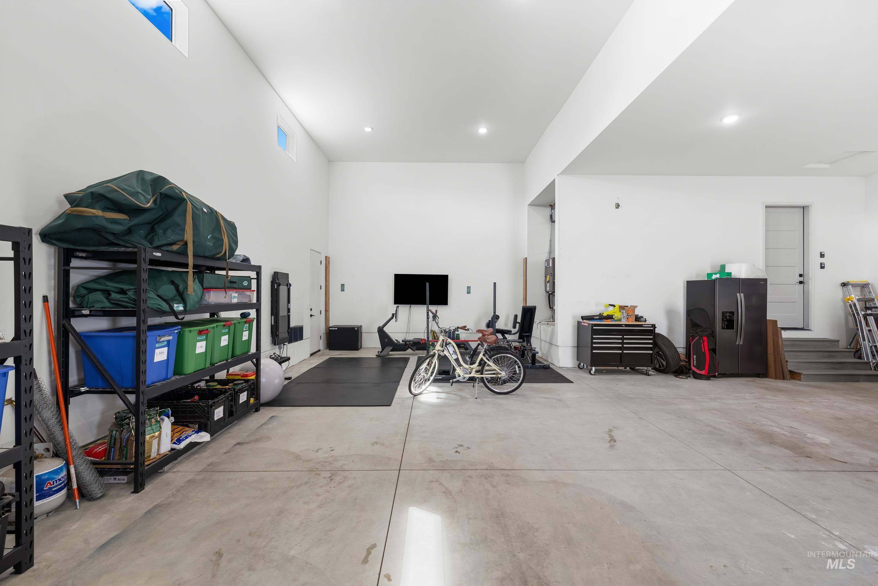 3483 South Grenze Way Meridian, ID 83642 - Photo 25 of 30 Garage featuring stainless steel fridge with ice dispenser