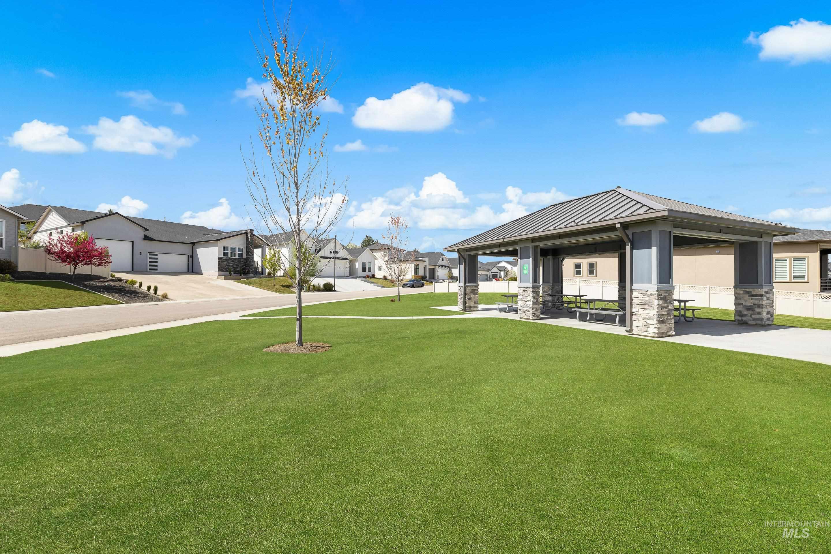3483 South Grenze Way Meridian, ID 83642 - Photo 30 of 30 View of green lawn featuring a patio area and a residential view
