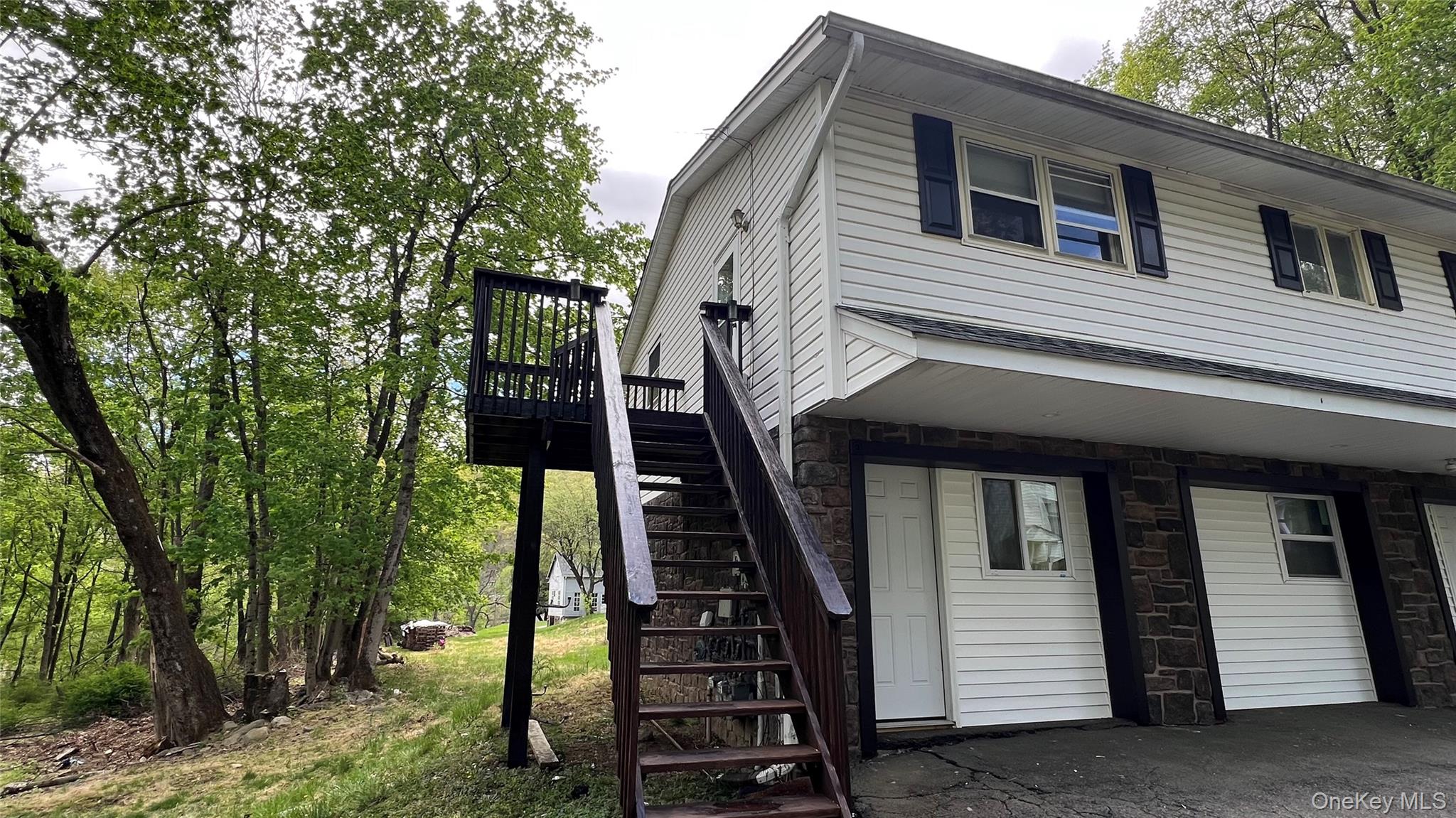 a front view of a house with stairs