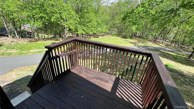 a view of deck with wooden floor and fence