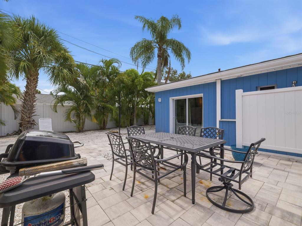 1207 1st Street Indian Rocks Beach, FL 33785 - Photo 31 of 60 a view of a backyard with furniture and a patio