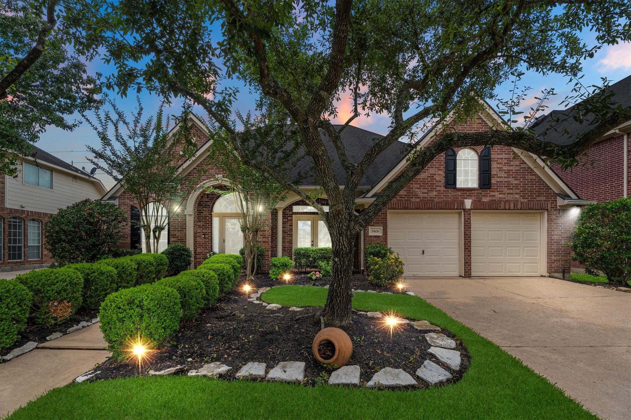 9406 Lochflora Drive Spring, TX 77379 - Photo 2 of 49 a front view of a house with garden