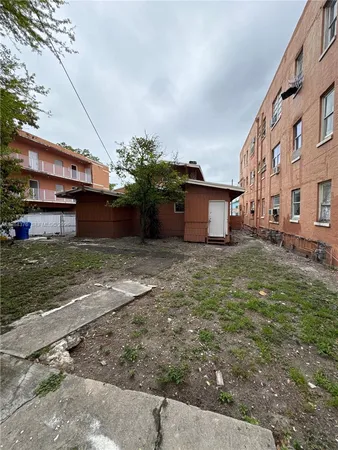 a house view with a garden space