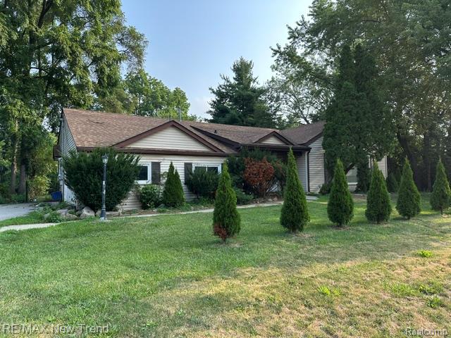 4510 West Maple Road Bloomfield Hills, MI 48301 - Photo 1 of 13 Residence featuring light-toned horizontal siding and a brown shingle roof