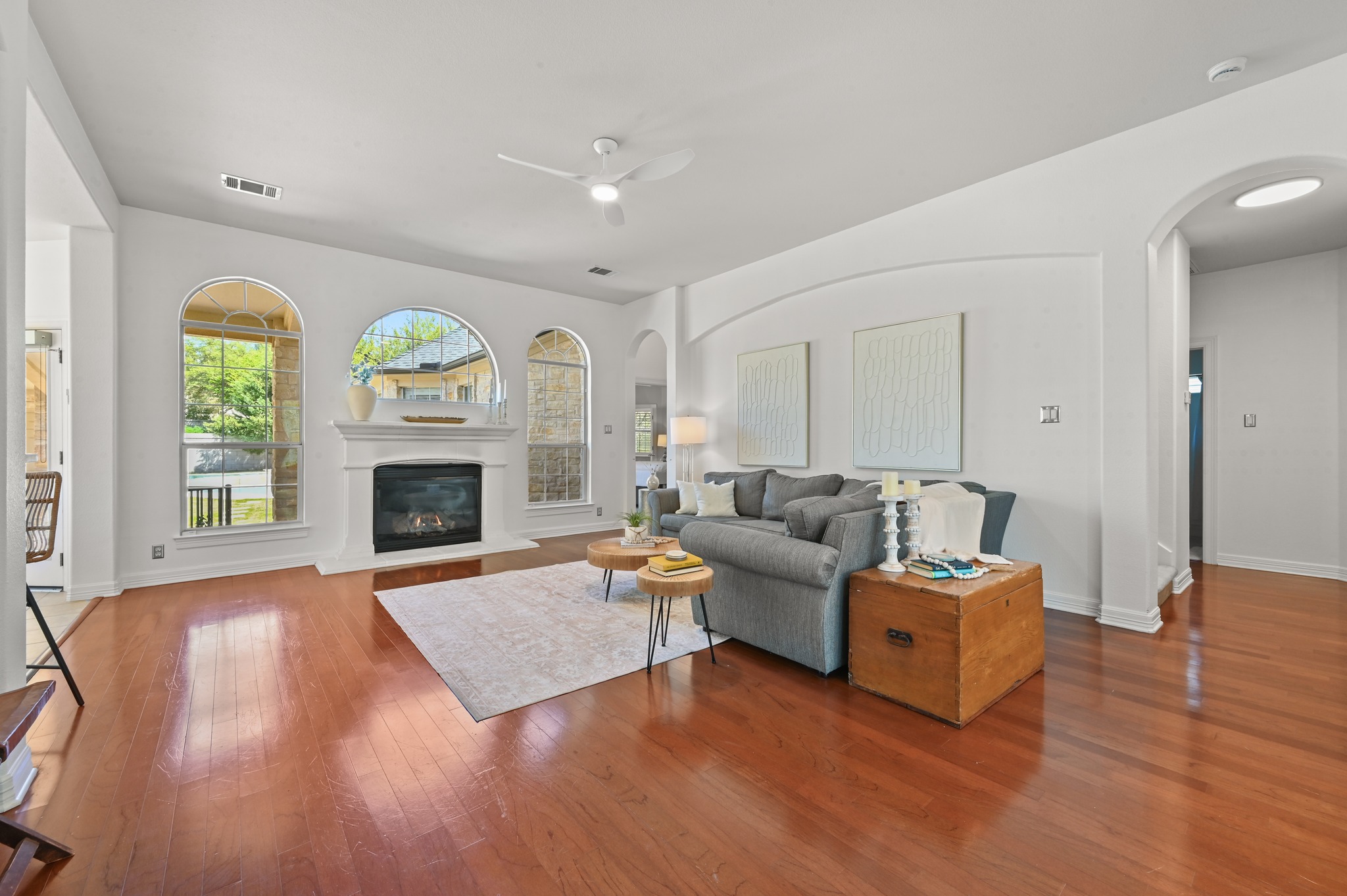 3125 Sun Drenched Path Austin, TX 78732 - Photo 14 of 38 Large windows along the back wall offer a clear view of the pool while keeping the living room bright and open