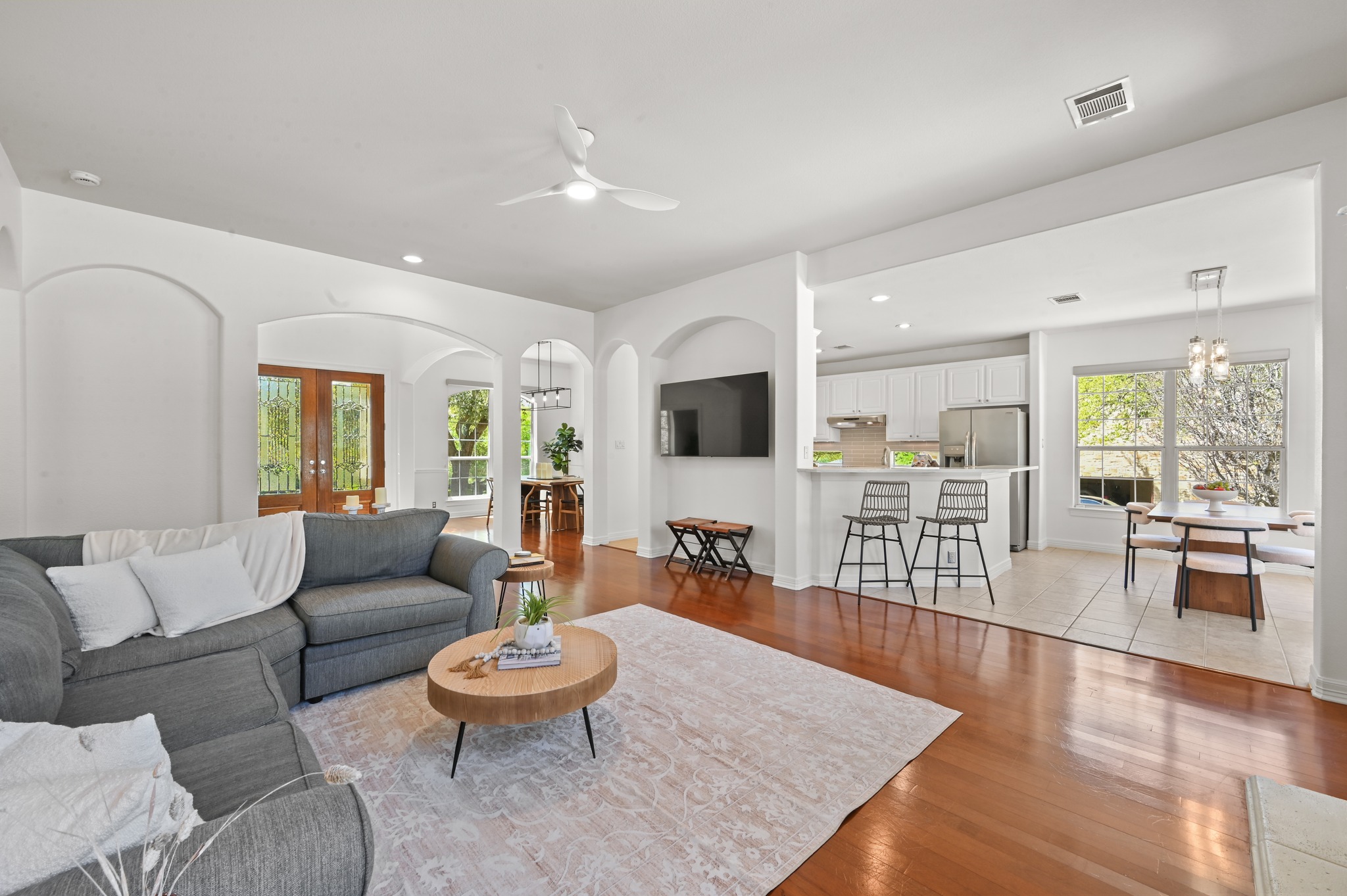 3125 Sun Drenched Path Austin, TX 78732 - Photo 2 of 38 The open layout connects the living area directly to the kitchen, making it easy to stay part of the conversation while hosting