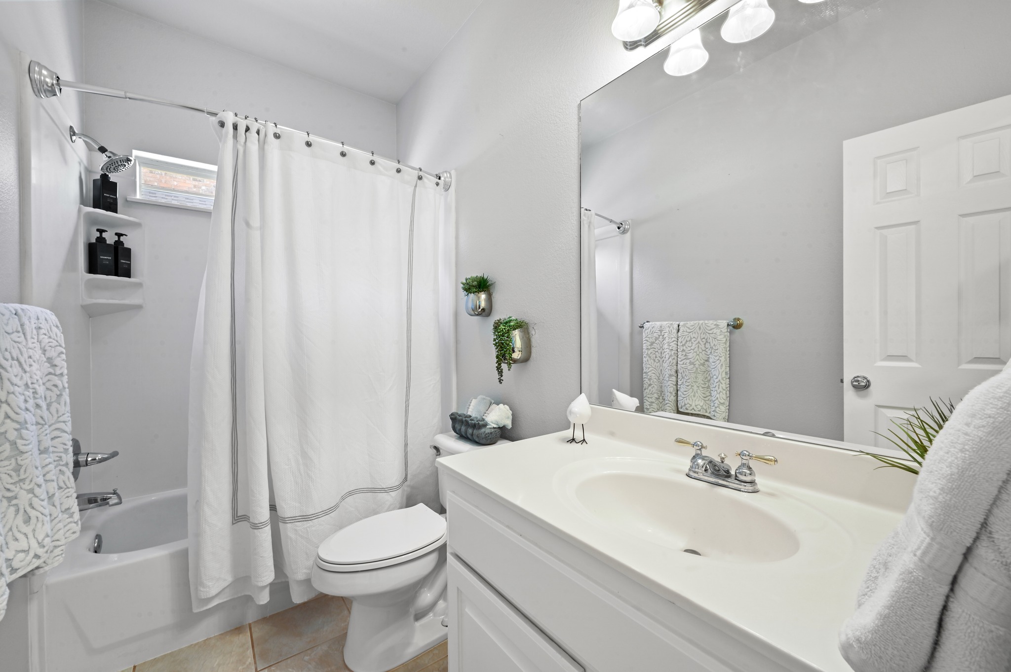 3125 Sun Drenched Path Austin, TX 78732 - Photo 22 of 38 Full guest bathroom on the main floor