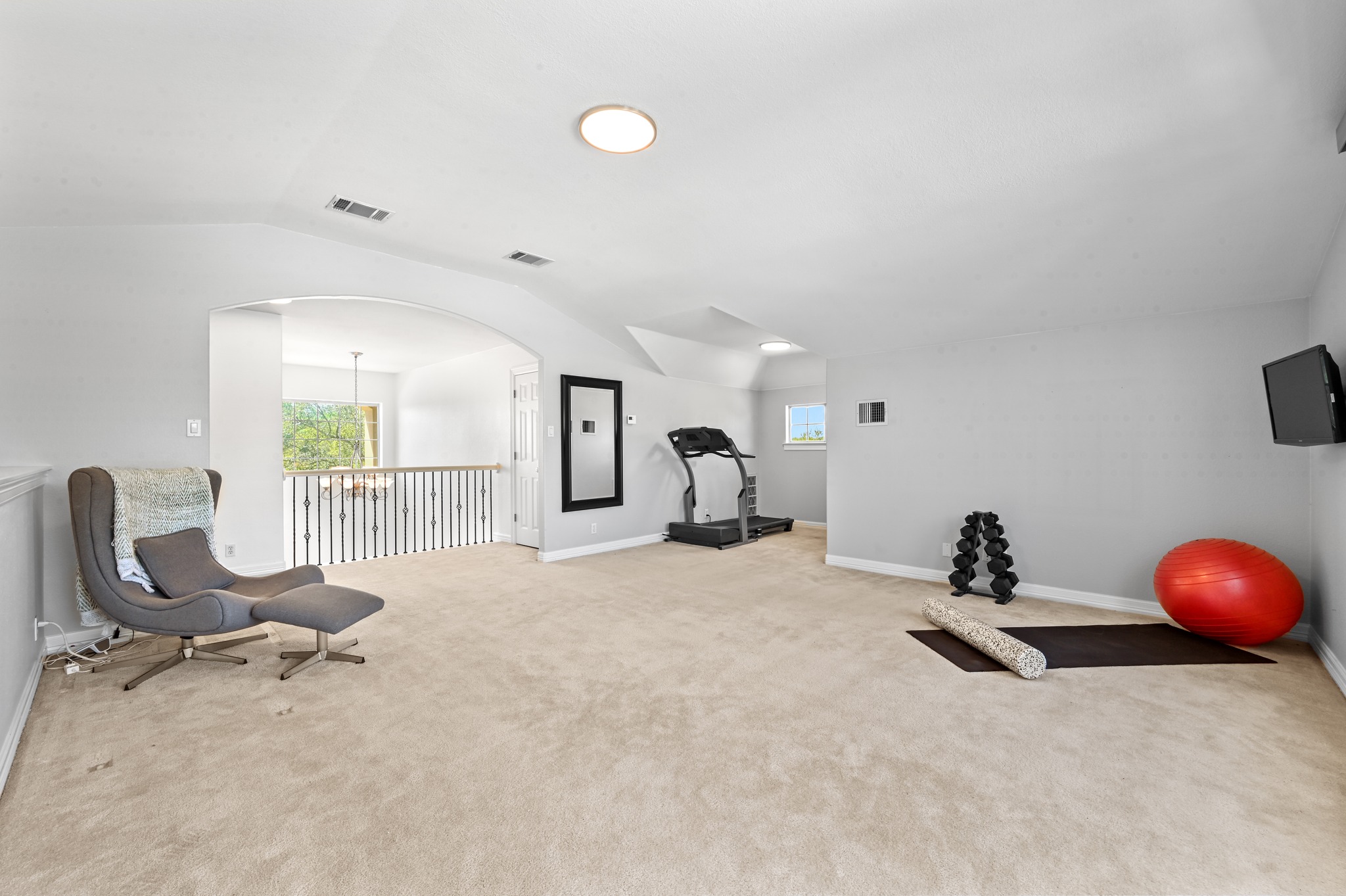 3125 Sun Drenched Path Austin, TX 78732 - Photo 24 of 38 The massive game room upstairs is a great spot for movie nights or hosting friends, and having a full bathroom right there makes it a very functional guest retreat