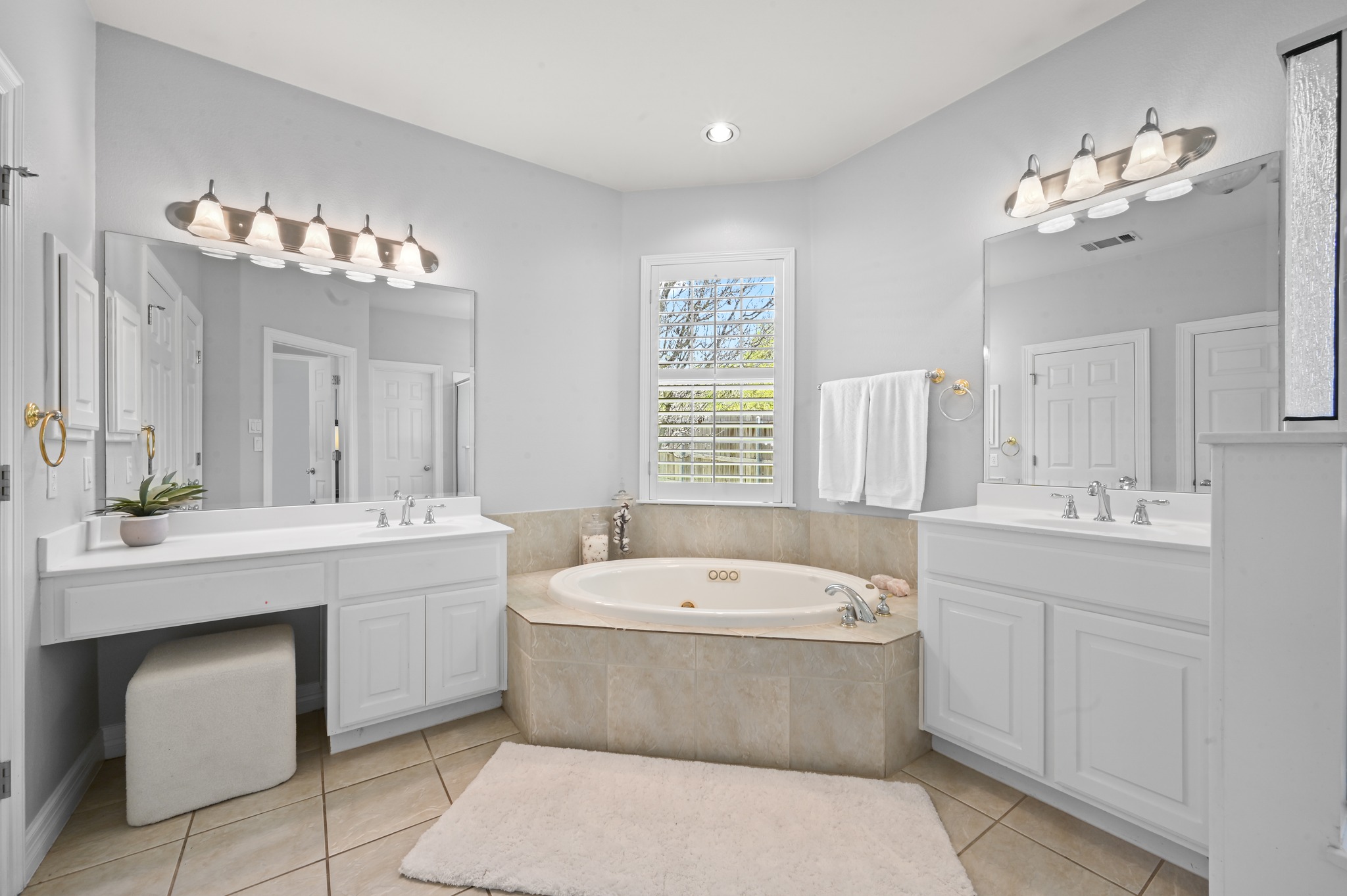 3125 Sun Drenched Path Austin, TX 78732 - Photo 5 of 38 The ensuite bath is designed for relaxation, featuring a jetted tub and a separate step-in shower