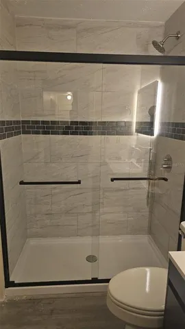 a bathroom with a sink vanity and a mirror