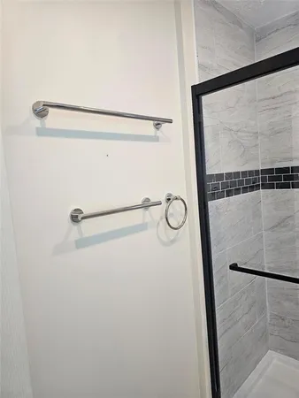 a bathroom with a toilet a sink and a shower