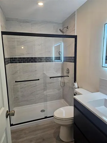a bathroom with a sink a toilet and a bathtub