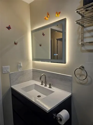 a bathroom with a sink and a mirror