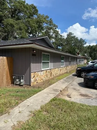 a swimming pool with outdoor seating and yard
