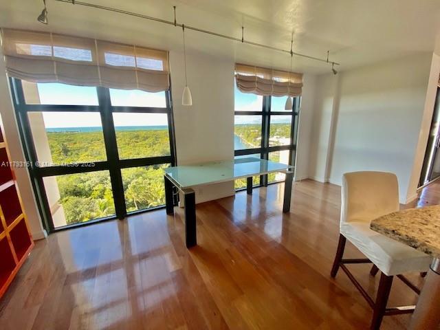 1121 Crandon Boulevard, Unit D802 Key Biscayne, FL 33149 - Photo 11 of 30 a view of a room with furniture and wooden floor