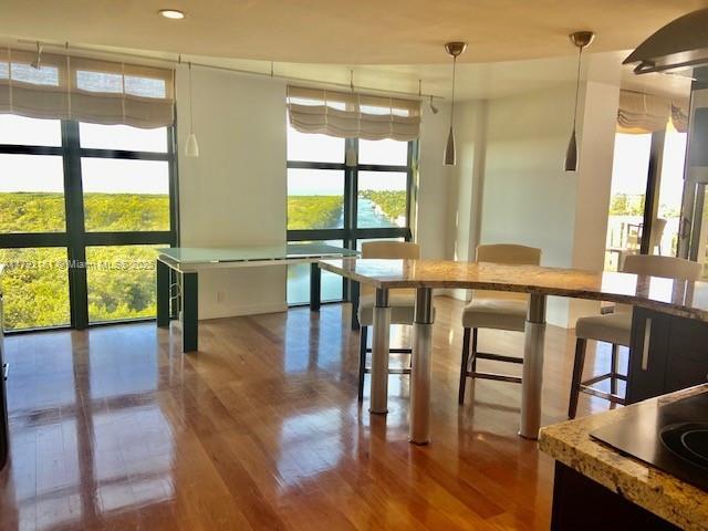 1121 Crandon Boulevard, Unit D802 Key Biscayne, FL 33149 - Photo 12 of 30 a view of a room with furniture and large windows