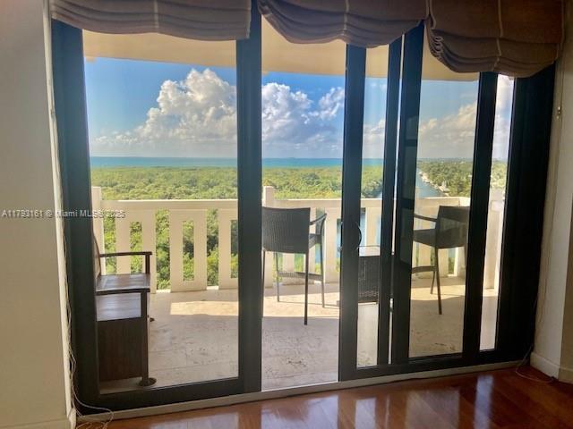1121 Crandon Boulevard, Unit D802 Key Biscayne, FL 33149 - Photo 20 of 30 a view of a room with wooden floor and a floor to ceiling window