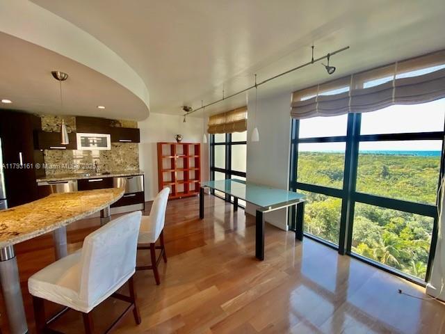 1121 Crandon Boulevard, Unit D802 Key Biscayne, FL 33149 - Photo 21 of 30 a dining hall with stainless steel appliances granite countertop a stove and view living room