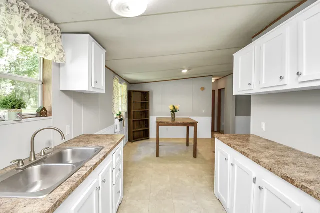 a kitchen with a stove and a sink