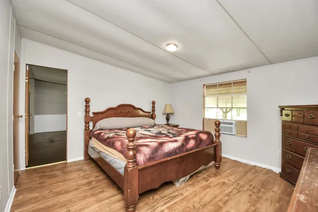 a bedroom with a bed and a cabinets