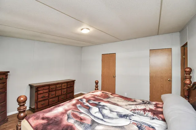 a view of a workspace with furniture and wooden floor