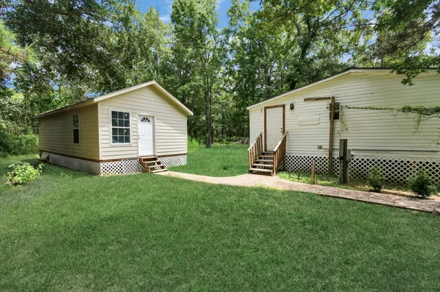 a backyard of a house with lots of green space