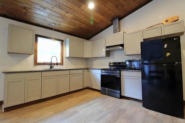 a kitchen with sink and cabinets