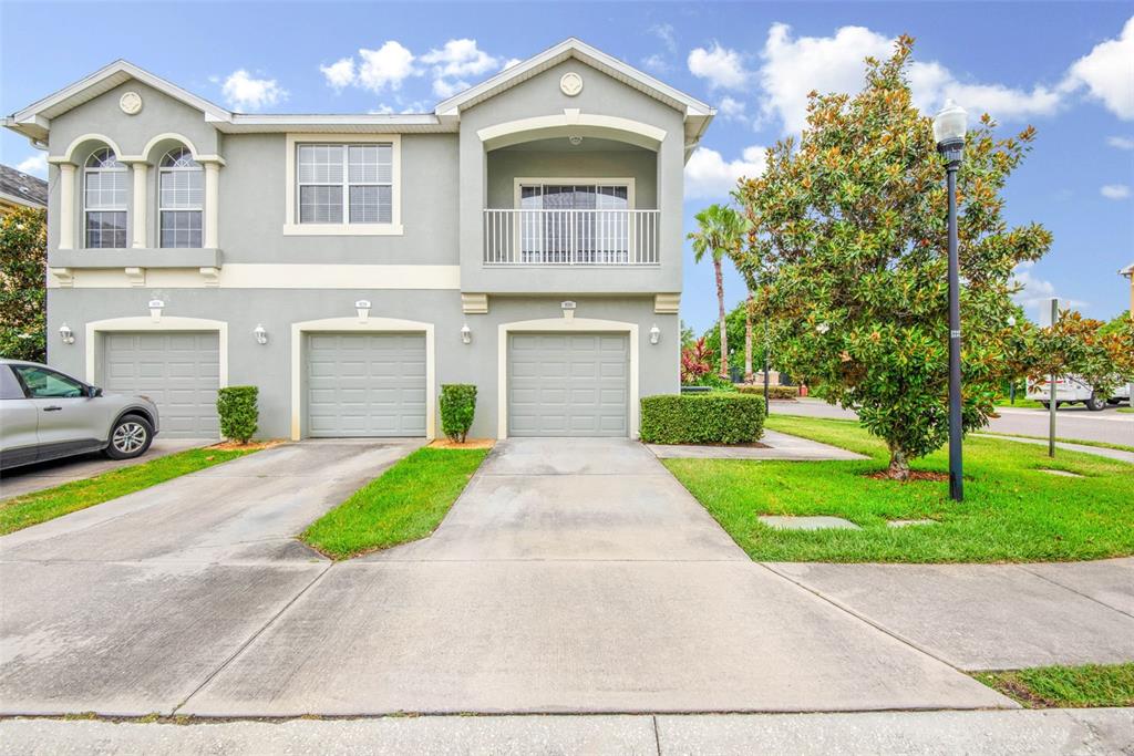 9140 Moonlit Meadows Loop Riverview, FL 33578 - Photo 1 of 1 a front view of a house with a yard and garage