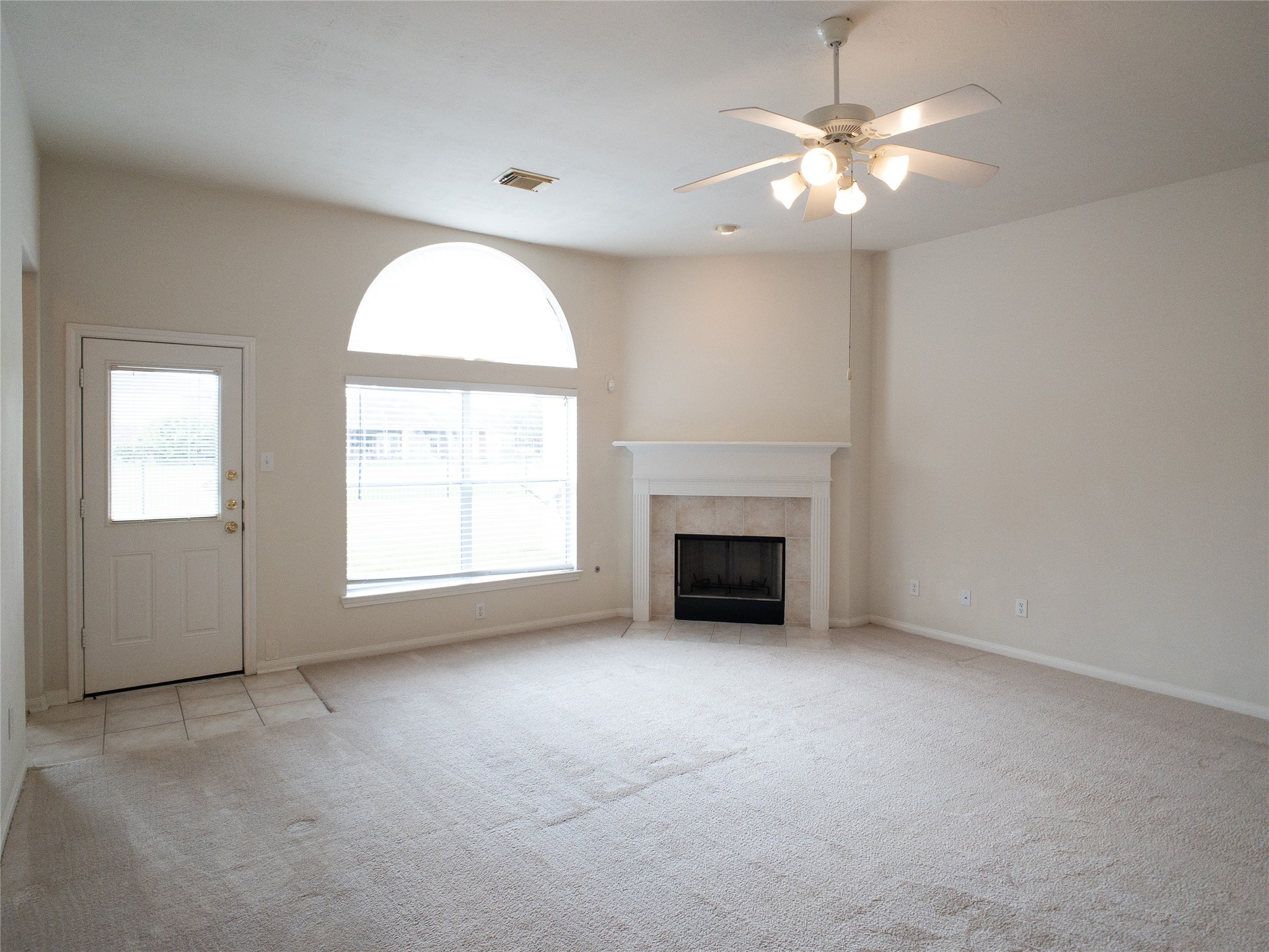 2727 South Cedar Hollow Drive Pearland, TX 77584 - Photo 14 of 41 FRESHLY STEAM-CLEANED neutral carpet in den; gas fireplace with mantel