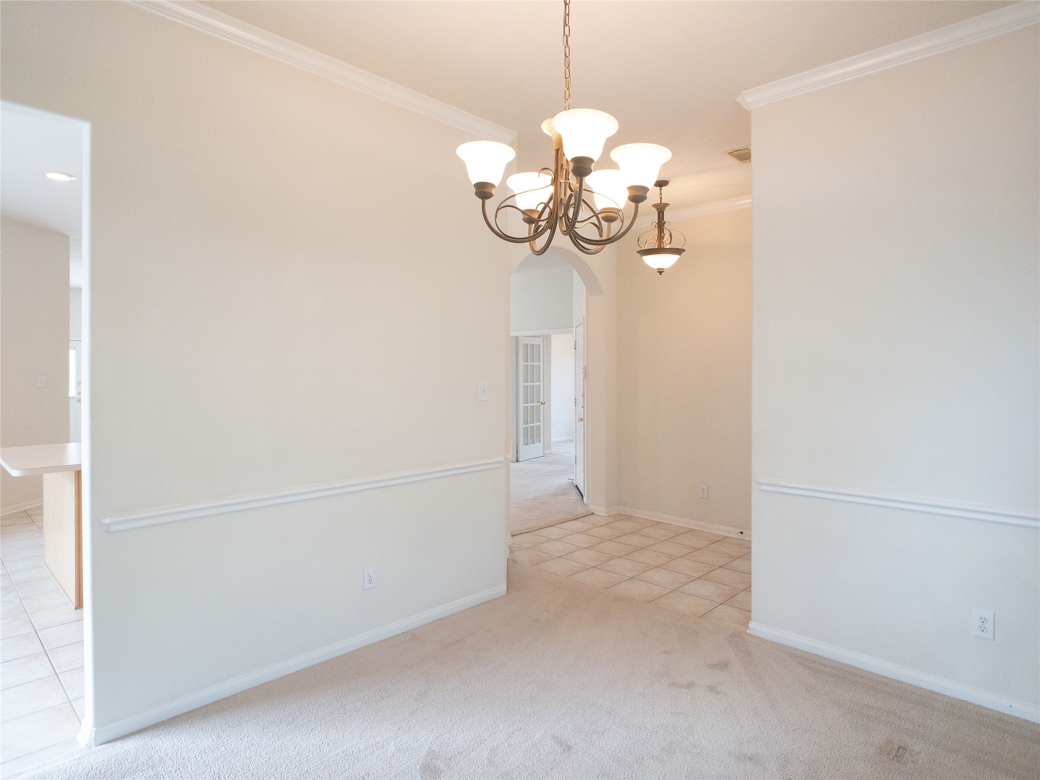 2727 South Cedar Hollow Drive Pearland, TX 77584 - Photo 7 of 41 reverse view of dining room looking toward tiled foyer on right and kitchen on left
