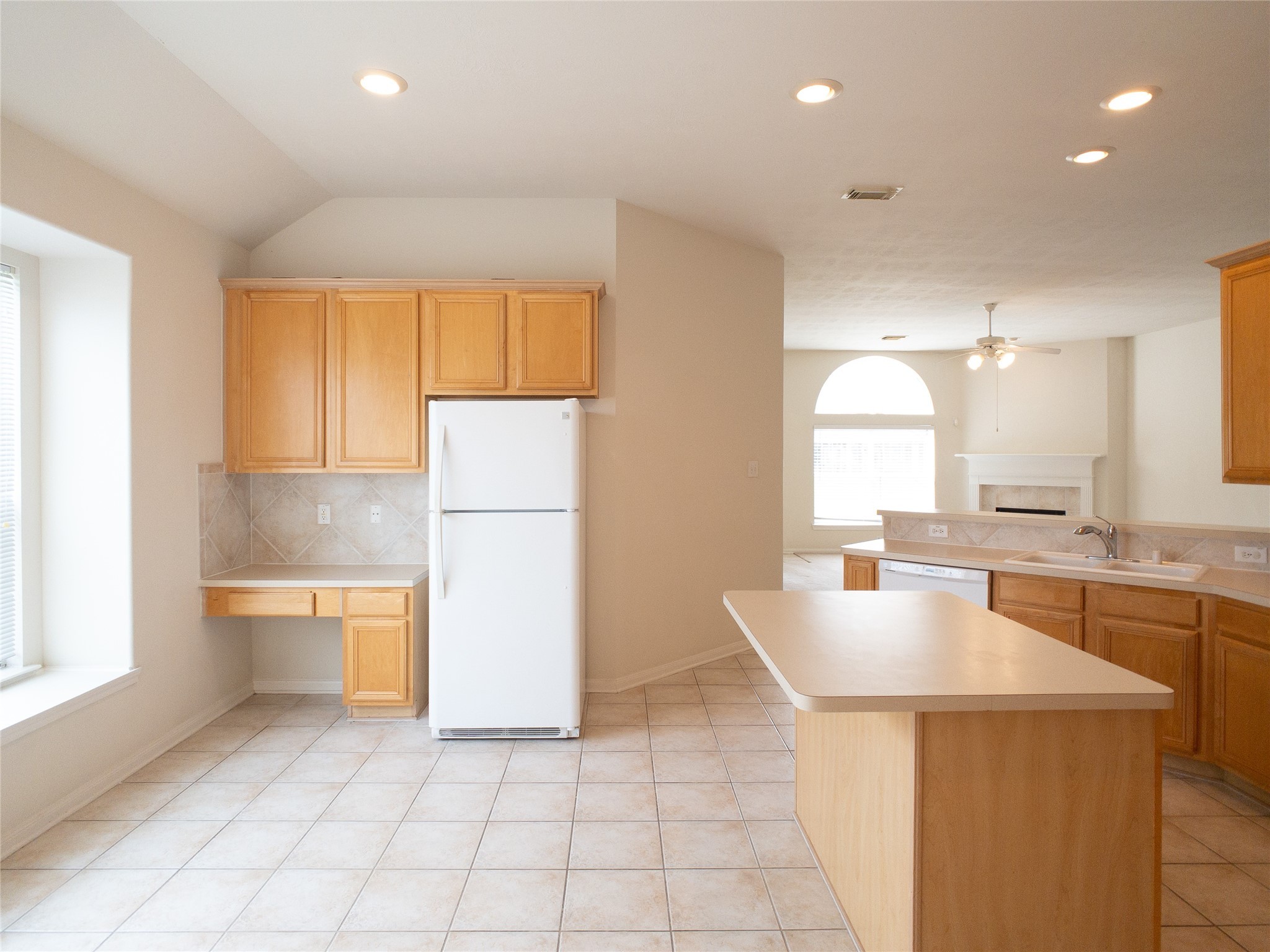 2727 South Cedar Hollow Drive Pearland, TX 77584 - Photo 8 of 41 built-in desk and island in kitchen with fridge included