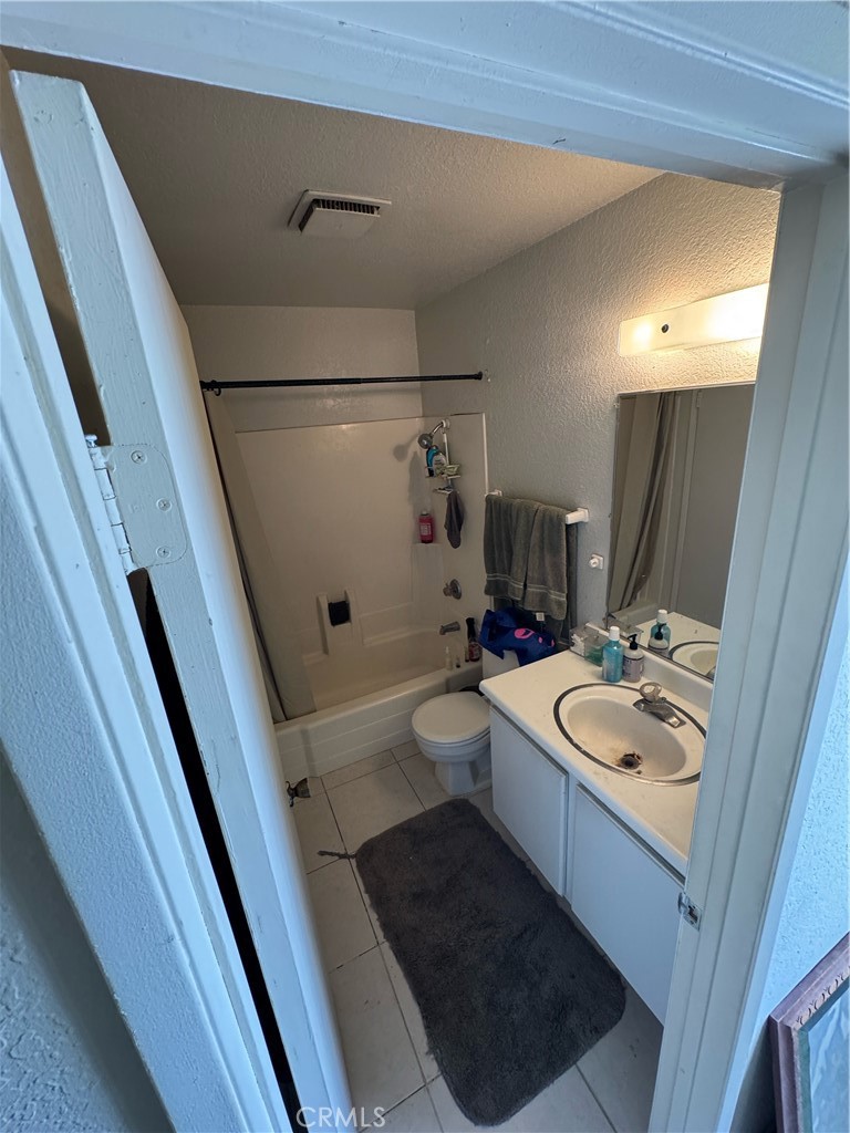 3700 Missouri Street West Covina, CA 91792 - Photo 11 of 14 a bathroom with a sink a toilet a mirror and shower