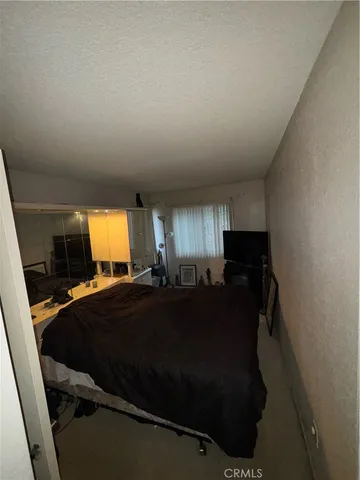 a bathroom with a sink toilet and mirror