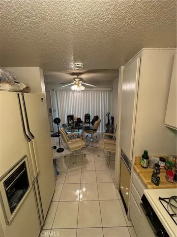 a bathroom with a sink a toilet a mirror and shower